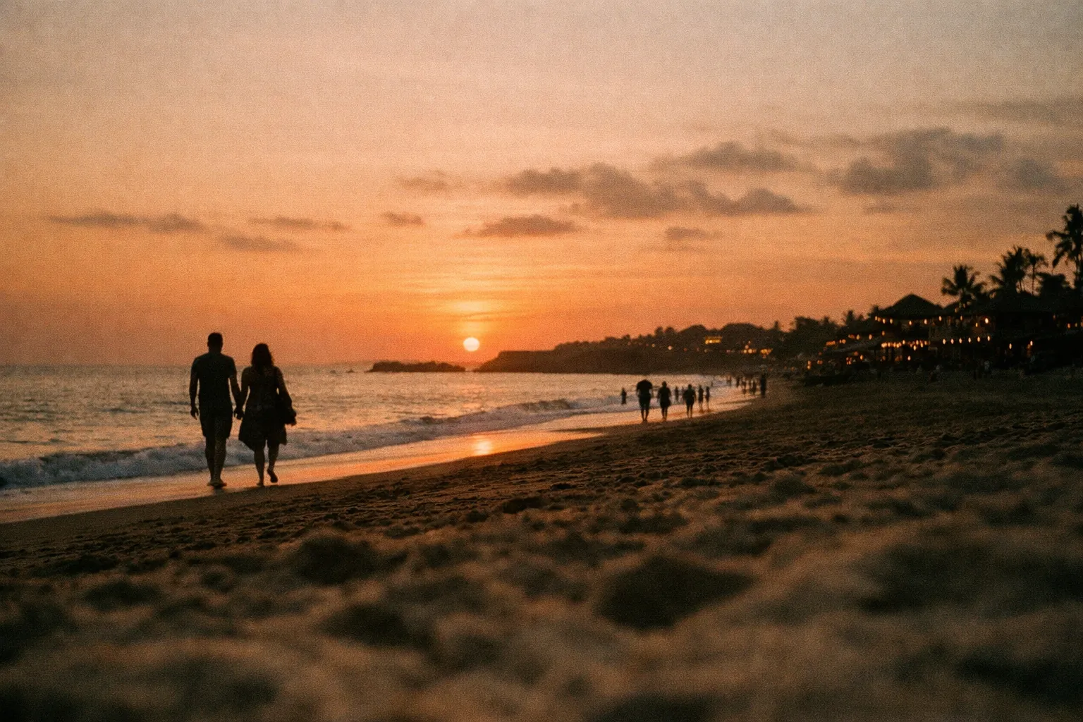 Sunset over Canggu's beaches with silhouettes along the shore