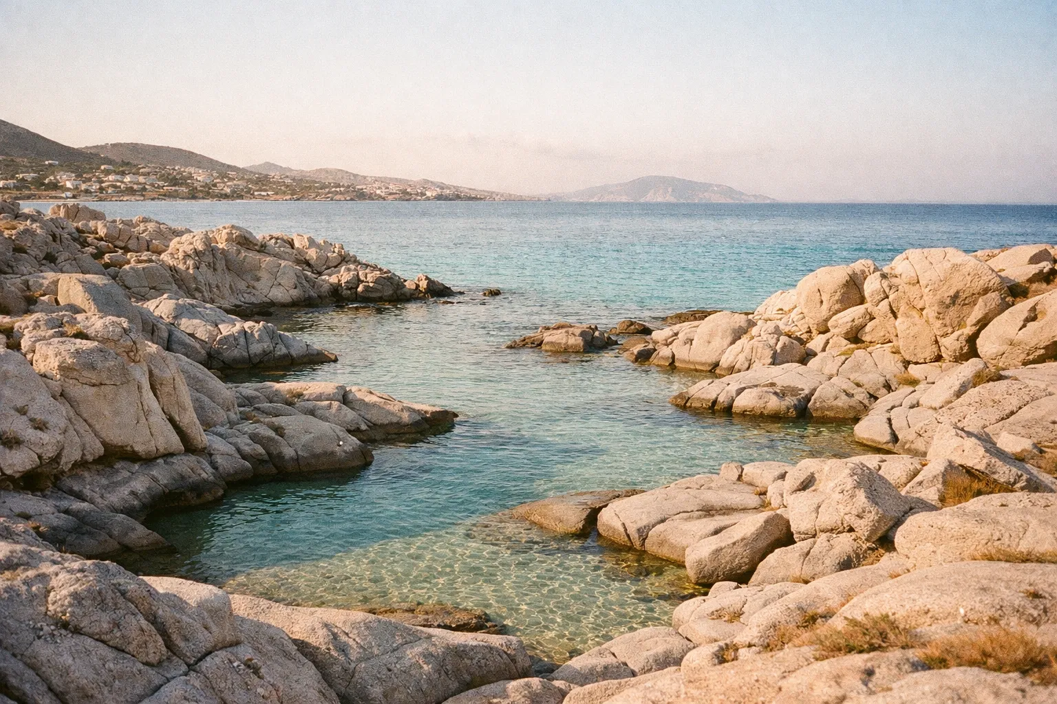 Kolymbithres rock formations and turquoise water at Paros beach during morning light