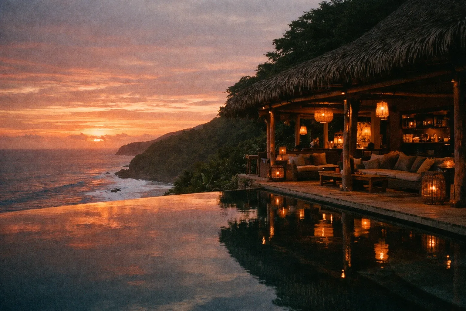 Clifftop eco-lodge at sunset with infinity pool and jungle backdrop